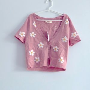 This is a pink pacsun sweater and it has never been worn!